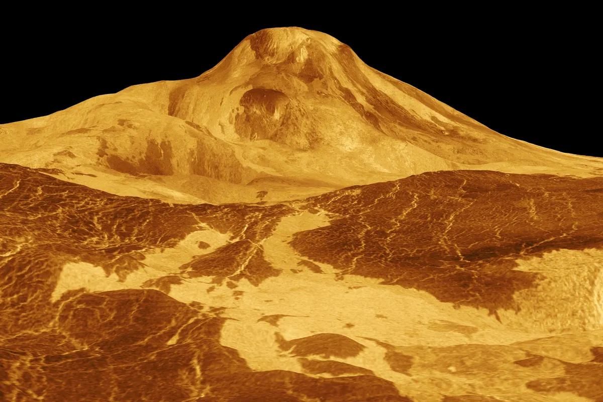 A three-dimensional view of the volcano Maat Mons on Venus in orange and gold